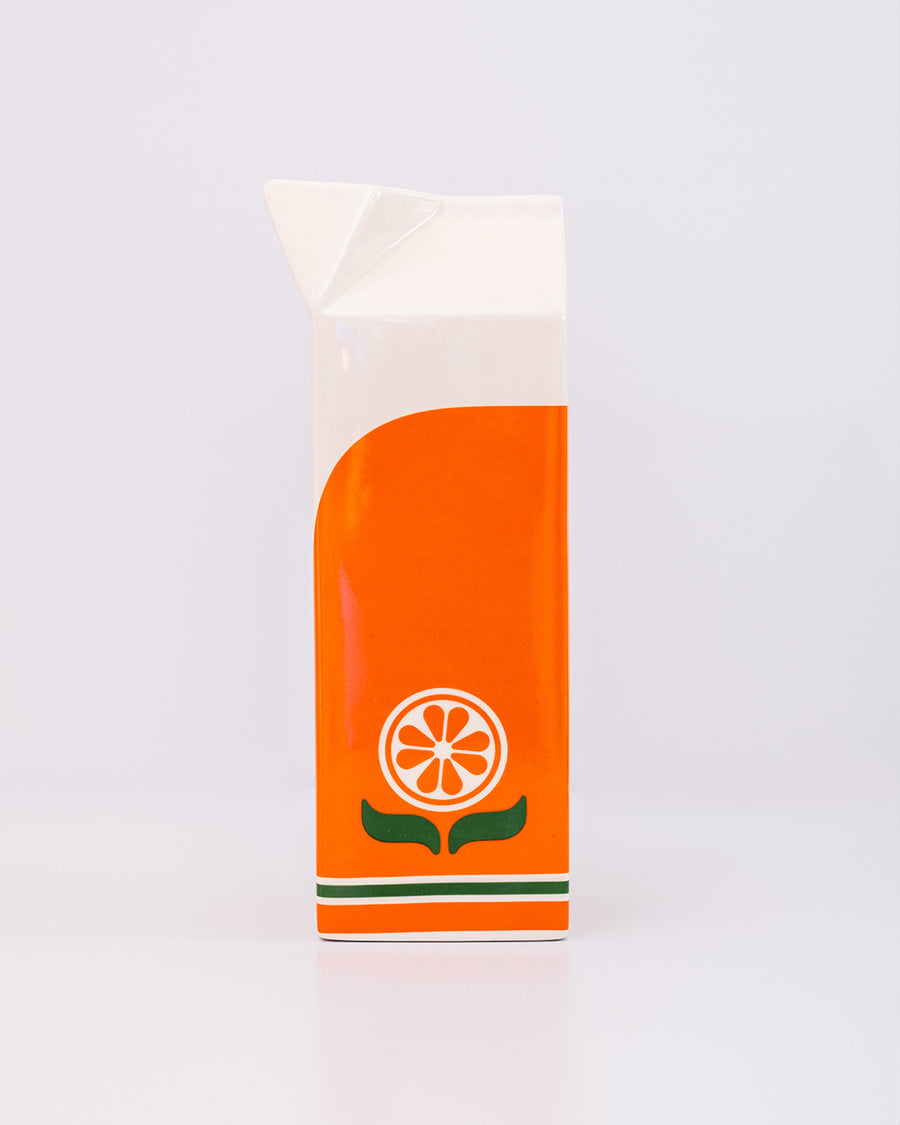 side view of ceramic orange juice carton-shaped vase