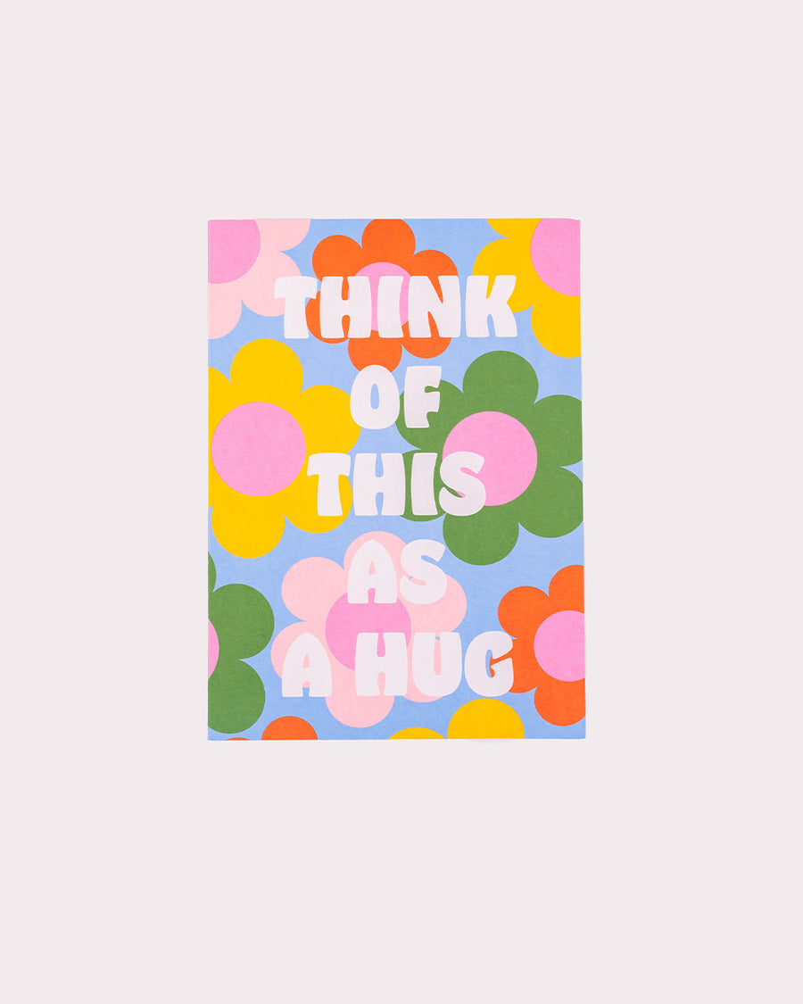 blue colorful floral greeting card with white 'think of this as a hug' typography