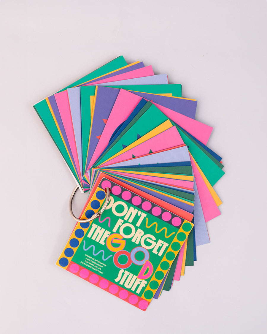 don't forget the good stuff: words of affirmation and encouragement spread on a table to show colorful pages