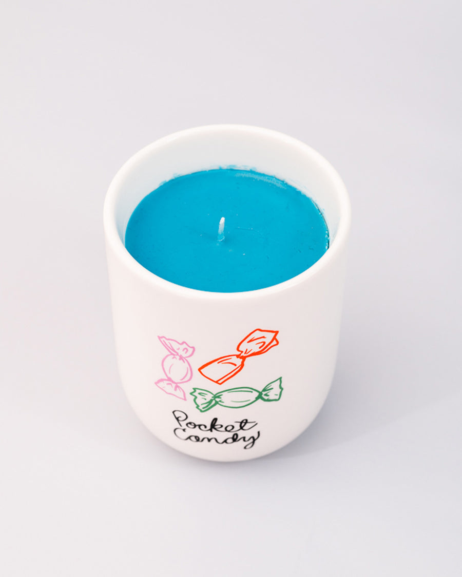 top view of sweet scented candle with 'pocket candy' across the front