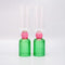 set of 2 bar glasses with green base and pink center detail