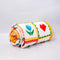 rolled colorful patchwork quilted blanket with heart, shamrocks, pretzels, smiley faces, cakes, and bows