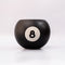 black magic 8 ball shaped vase on a grey ground