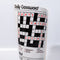 up close of crossword puzzle on rolled newspaper shaped vase