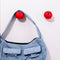 front view of blue baggu bag on cherry shaped hooks