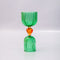 side view of green double shot glass with yellow heart detail