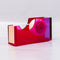 side view of pink, blue and red acrylic tape dispenser