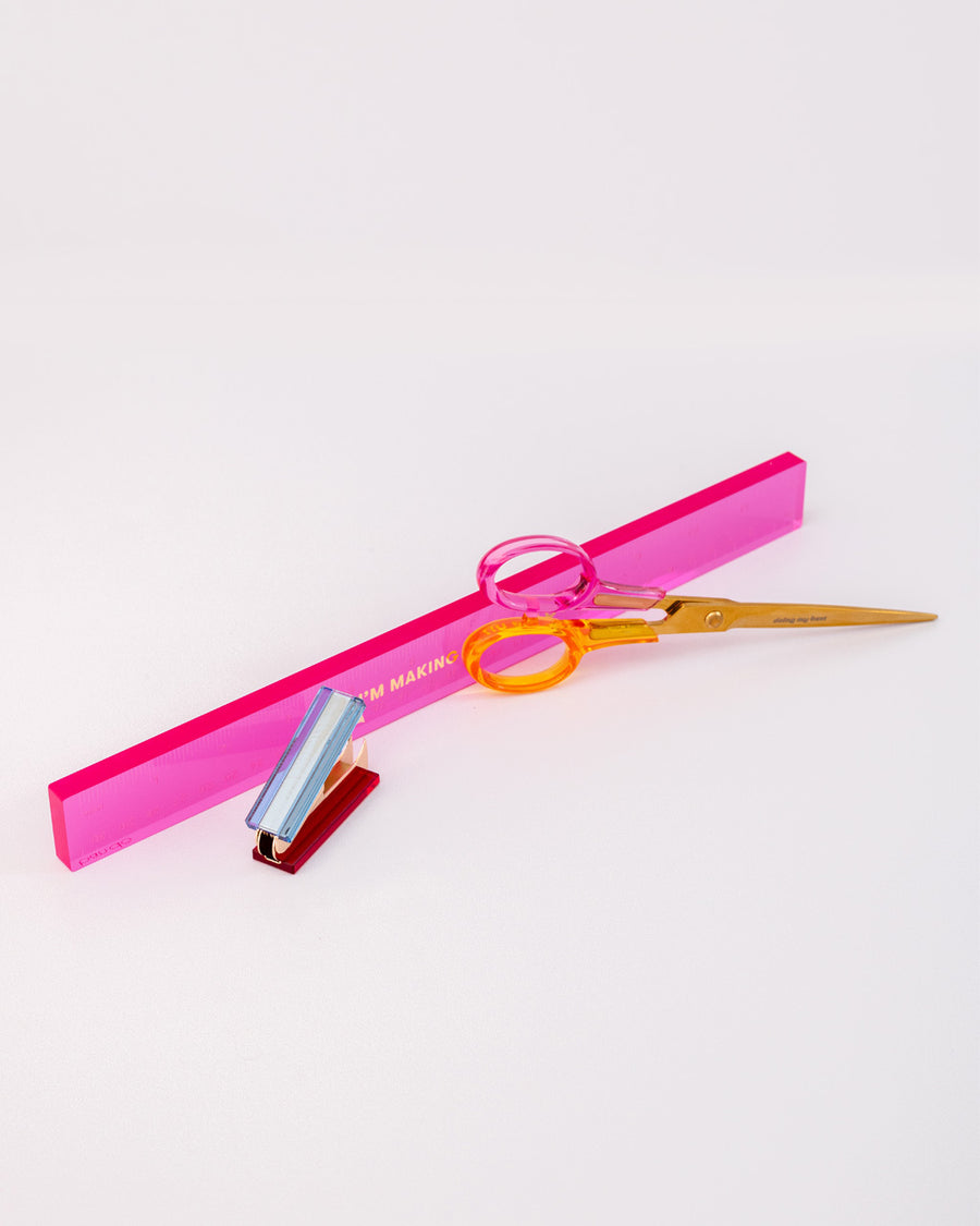 scattered desk set with pink acrylic ruler with gold 'i'm making it up as i go', colorful acrylic staple remover and scissors