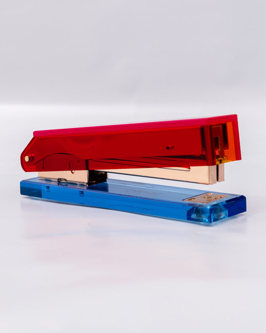 side view of pink, red and blue acrylic stapler