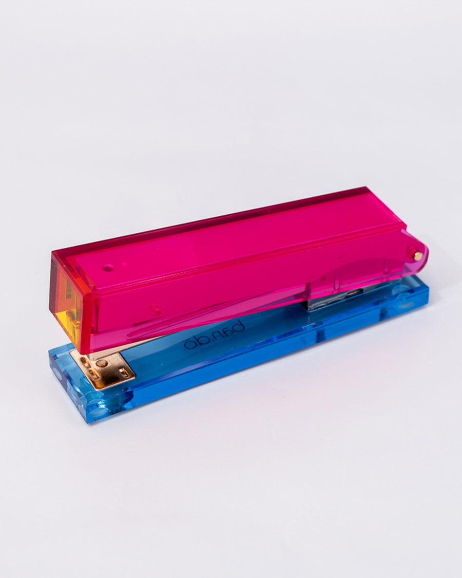 top view of pink, red and blue acrylic stapler