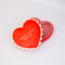 red heart shaped jewelry box with pink interior and cream scalloped detail with 'sweet little jewelry' across the front