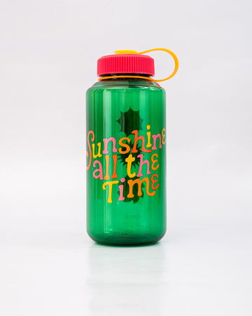 green nalgene like bottle with pink lid, yellow strap and colorful 'sunshine all the time' across the front