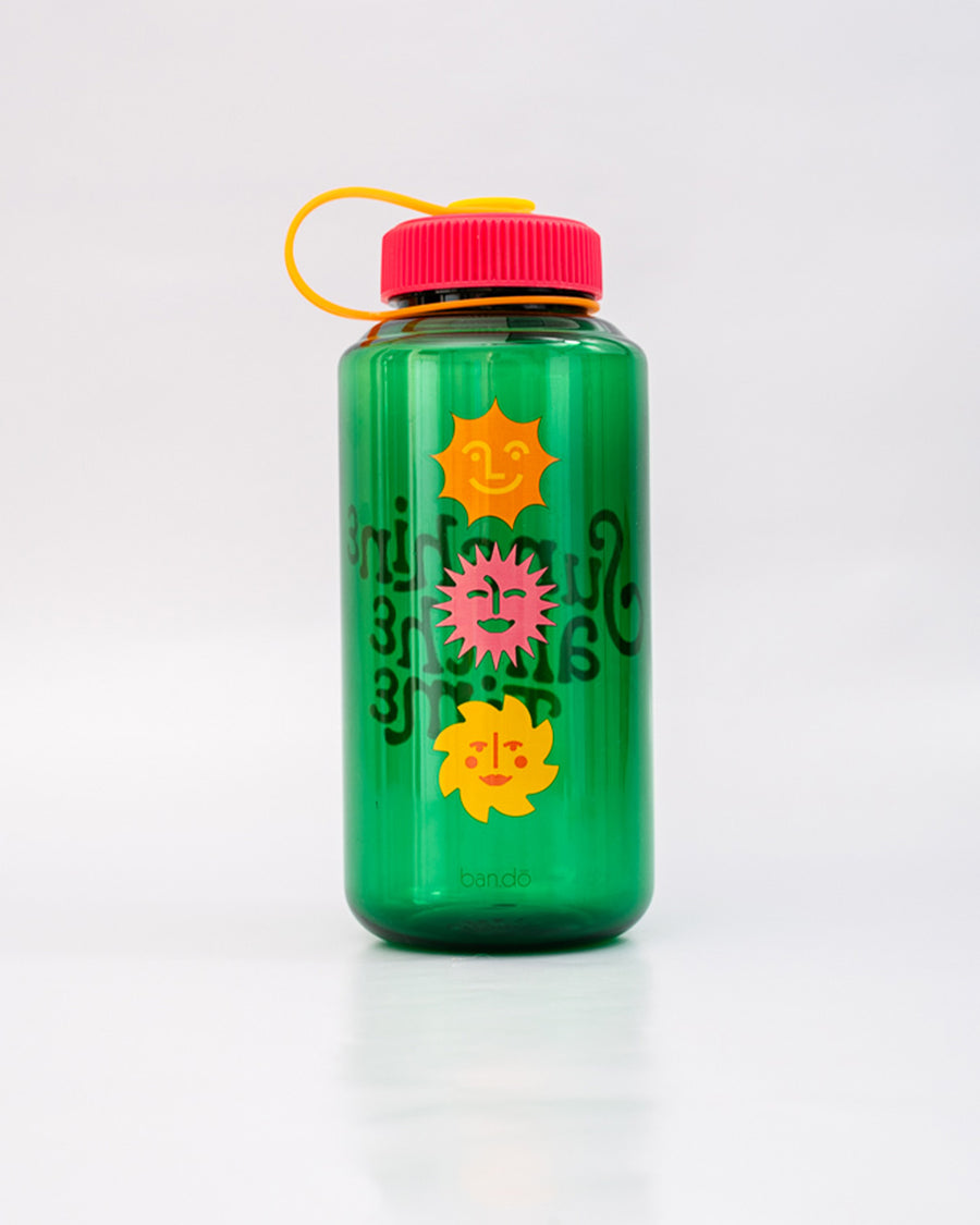 back view of green nalgene like bottle with pink lid, yellow strap and colorful 'sunshine all the time' across the front with vertical colorful sun print