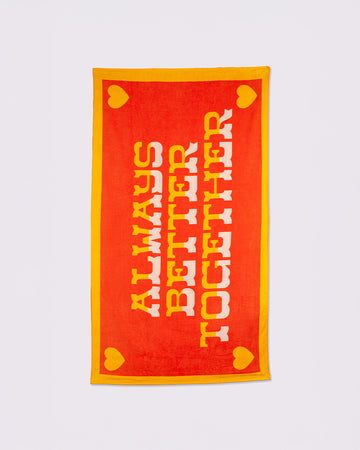 red oversized towel with golden yellow trim and yellow and white ombre 'always better together'