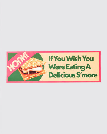 green, yellow and pink bumper sticker with s'mores design and says 'honk! if you wish you were eating a delicious s'more' typography