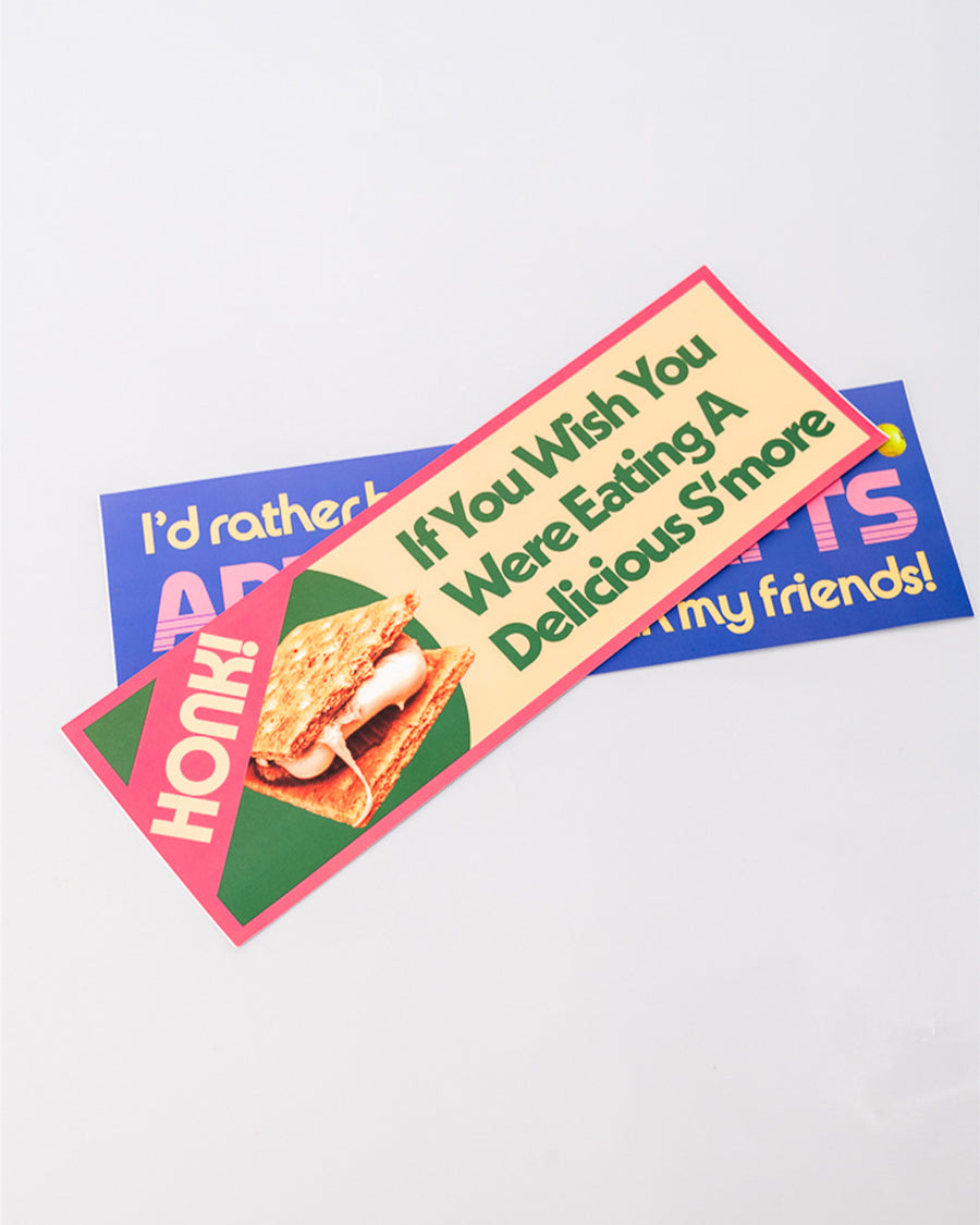 stacked green, yellow and pink bumper sticker with s'mores design and says 'honk! if you wish you were eating a delicious s'more' typography