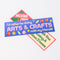 stacked blue bumper sticker with retro 'i'd rather be doing arts & crafts with my friends' typography and bead design