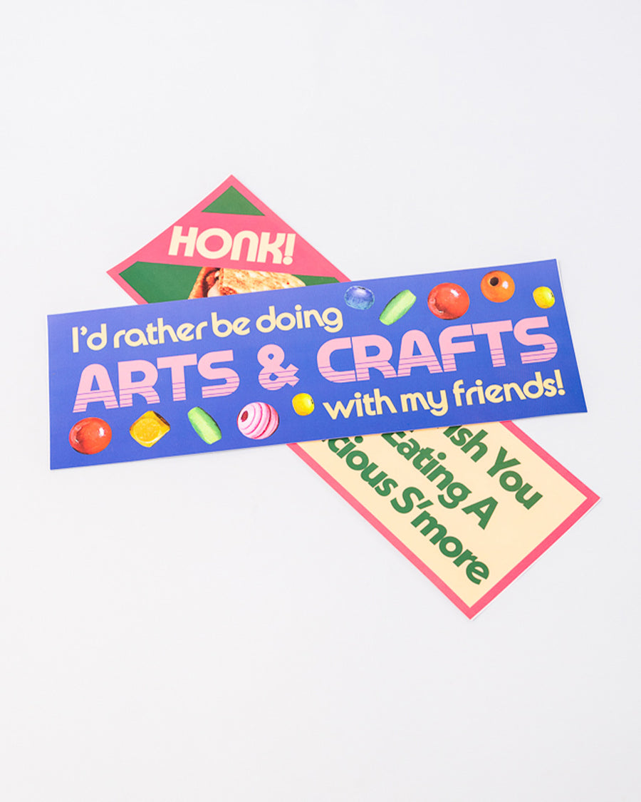 stacked blue bumper sticker with retro 'i'd rather be doing arts & crafts with my friends' typography and bead design