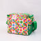 back view of colorful 'quilted' star lunch bag with green trim and strap and front pocket