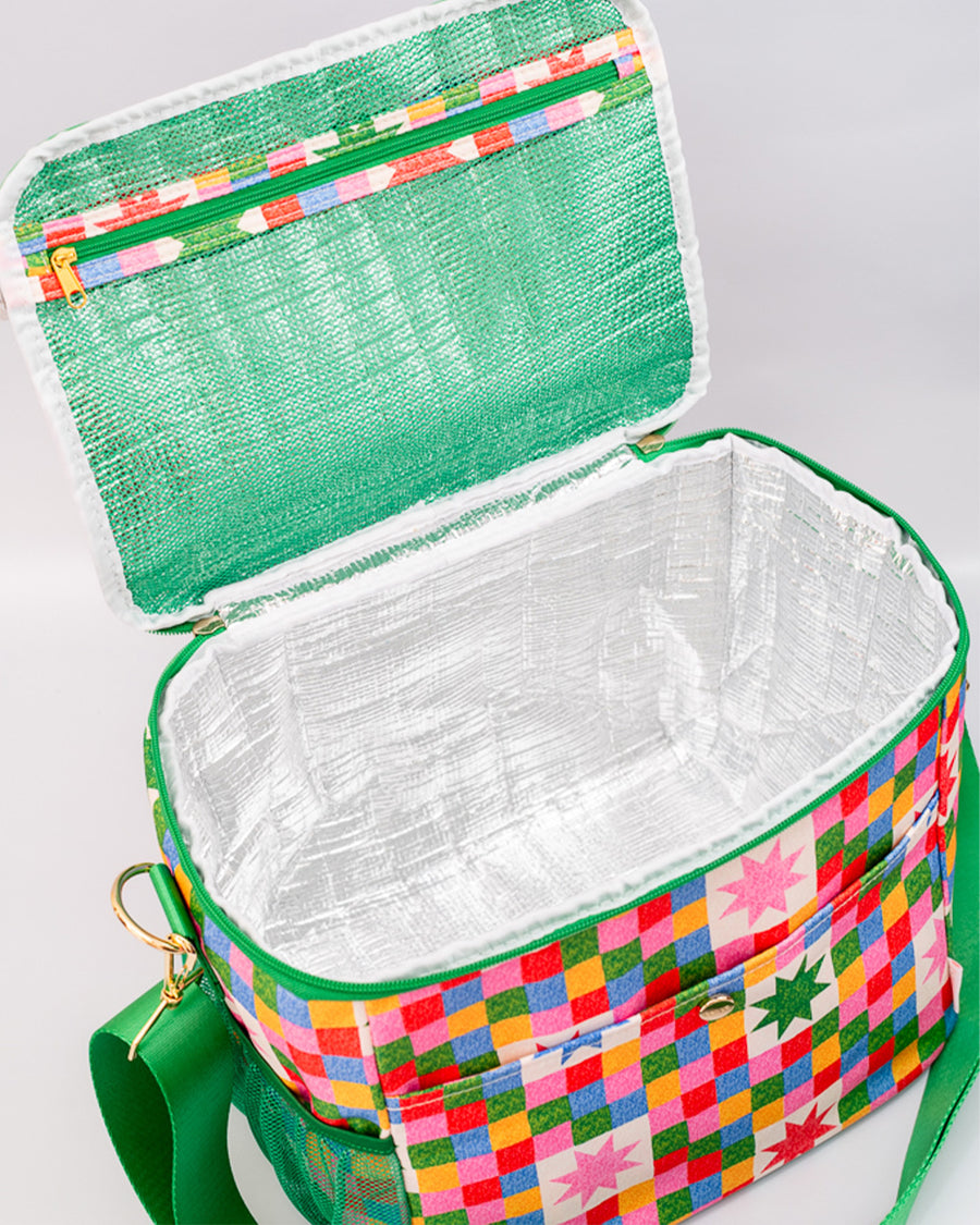 interior of colorful 'quilted' star lunch bag with green trim and strap and front pocket