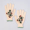 cream gardening gloves with white flower and strawberry print and green trim