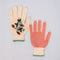 red non-slip bottom of cream gardening gloves with white flower and strawberry print and green trim