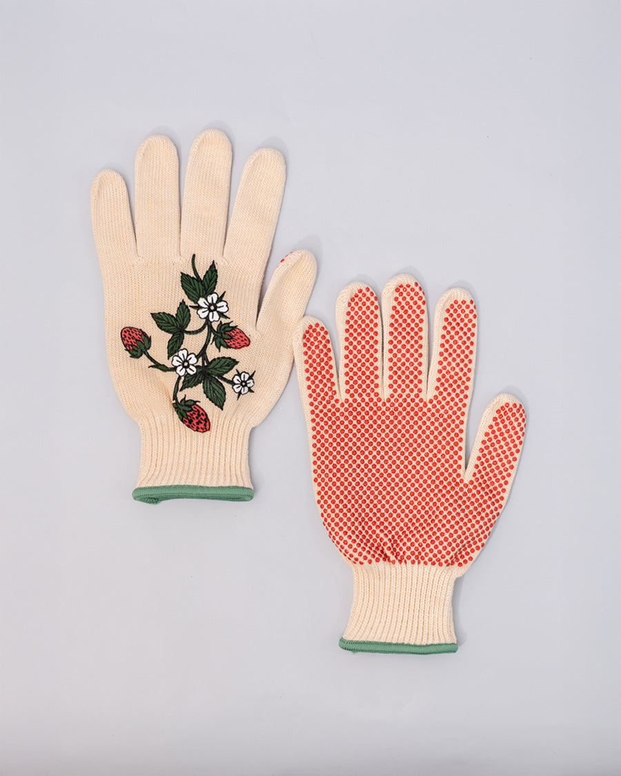 red non-slip bottom of cream gardening gloves with white flower and strawberry print and green trim