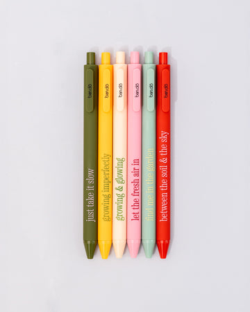 set of 6 colorful clickable pen set with various gardening sayings