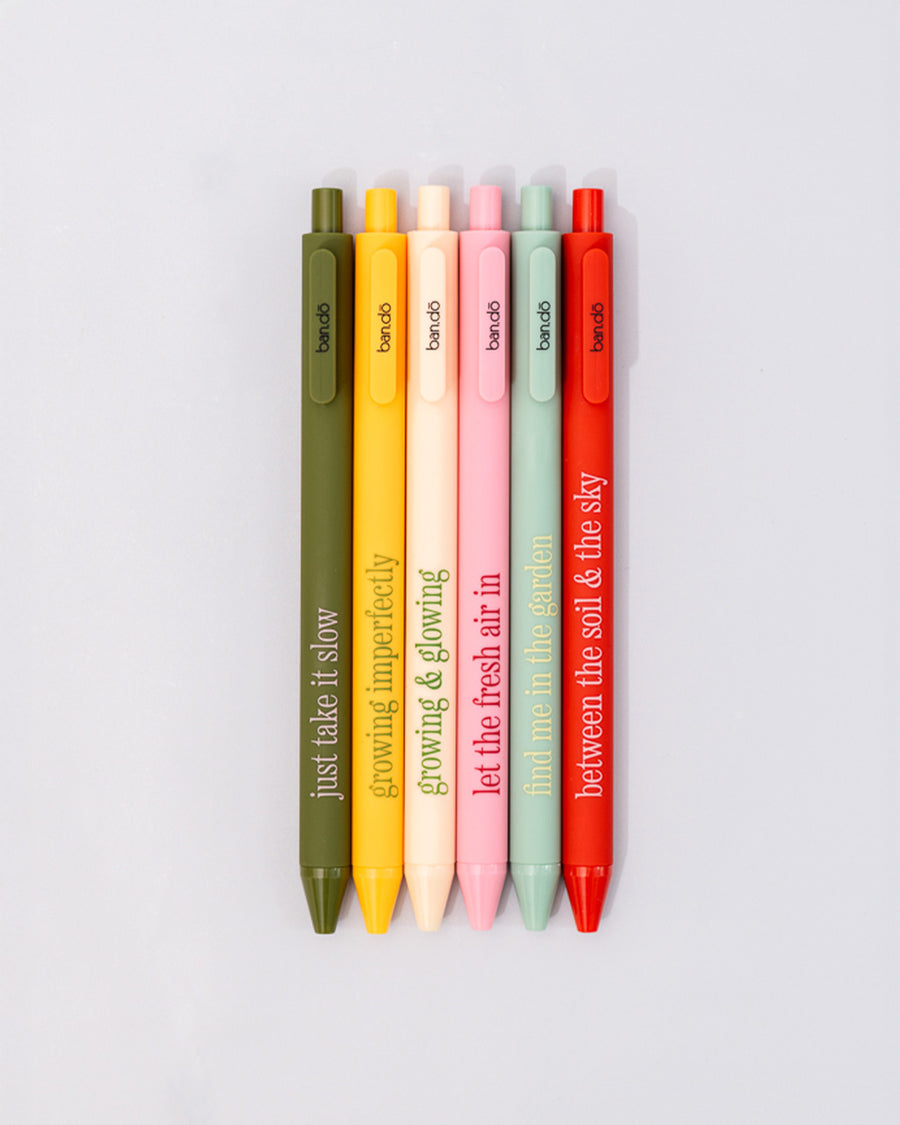 set of 6 colorful clickable pen set with various gardening sayings