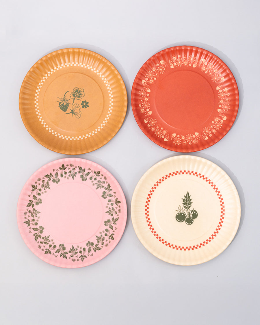 set of 4 dessert plates with ridge edges: golden strawberry, pink with green garden border, cream with green plant print and red checkered border and red with golden garden border