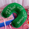 green velvet travel pillow with white 'what a dream' with pink bow on a pink ground