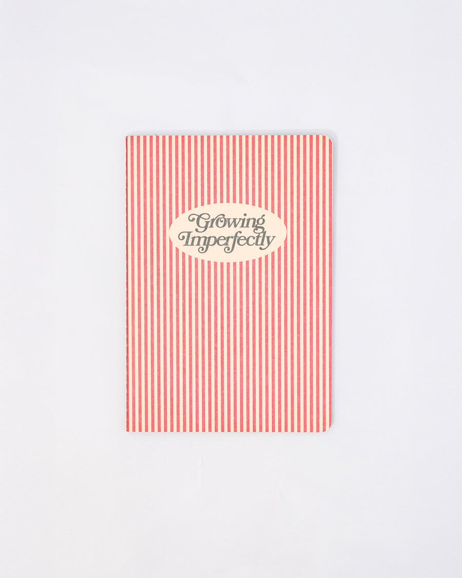 red and cream vertical stripe with cream circle with 'growing imperfectly' inside