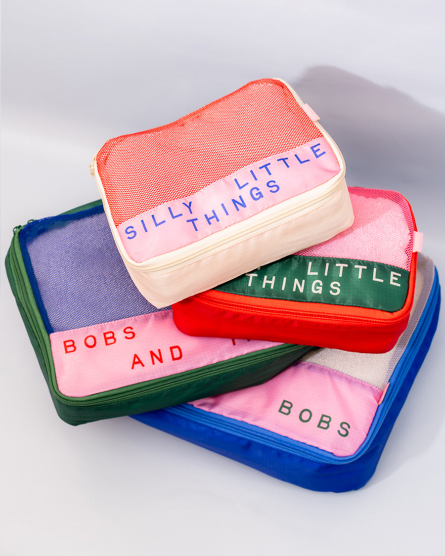 scattered set of 4 packing cubes: silly little things,  sweet little things, bobs and things, and bits and bobs