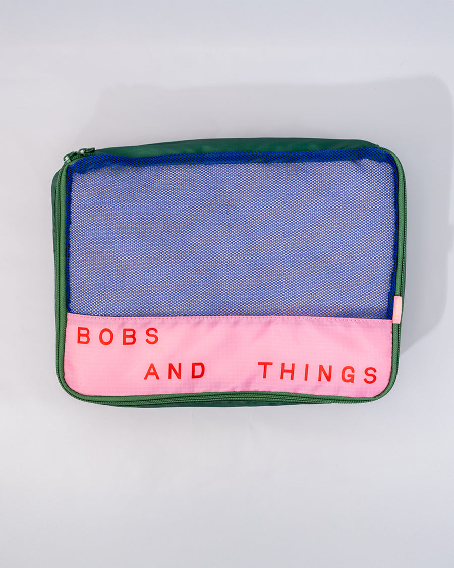 blue and pink medium packing cube with 'bobs and things' typography