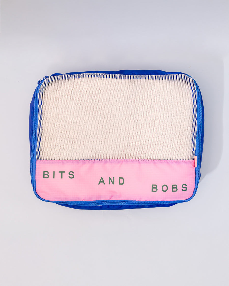 blue and pink large packing cube with 'bits and bobs' typography