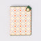 cream passport holder with blue diamond design with hearts and cherries and green side snap closure