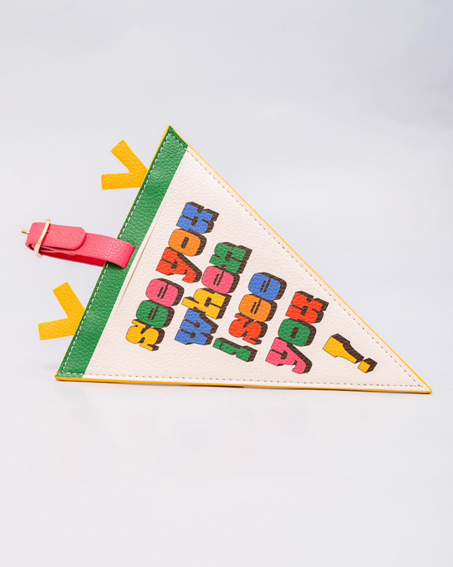 up close of cream pennant luggage tag with colorful 'see you when i see you!' front and pink, yellow and green trim