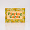 boxed set of two retro floral playing card decks with yellow, gold and green flowers