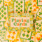 set of two retro floral playing card decks with yellow, gold and green flowers