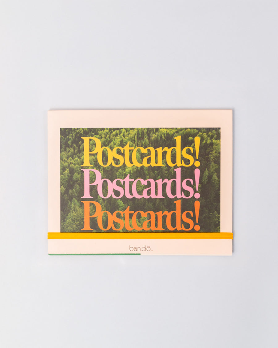 colorful postcards book with yellow elastic closure strap