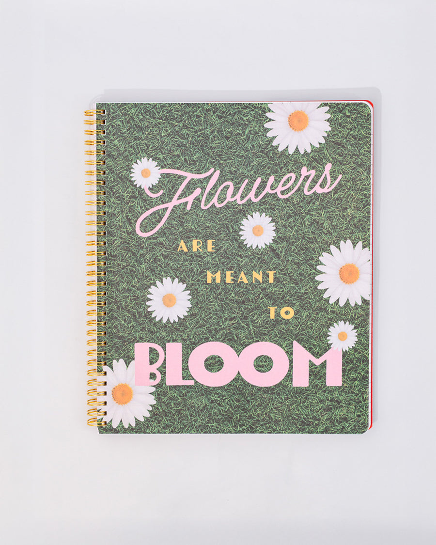 interior graphics with pink and yellow 'flowers are meant to bloom' with grass and white daisy background