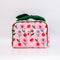 pink quilted toiletry bag with green bow handle and all over periwinkle flower, cherries, bow and lip print