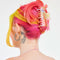 model wearing pastel rainbow large hair claw with double teeth