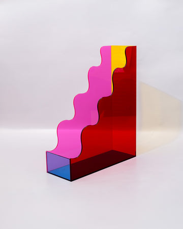 left view of red, pink, yellow and blue acrylic wavy file folder holder