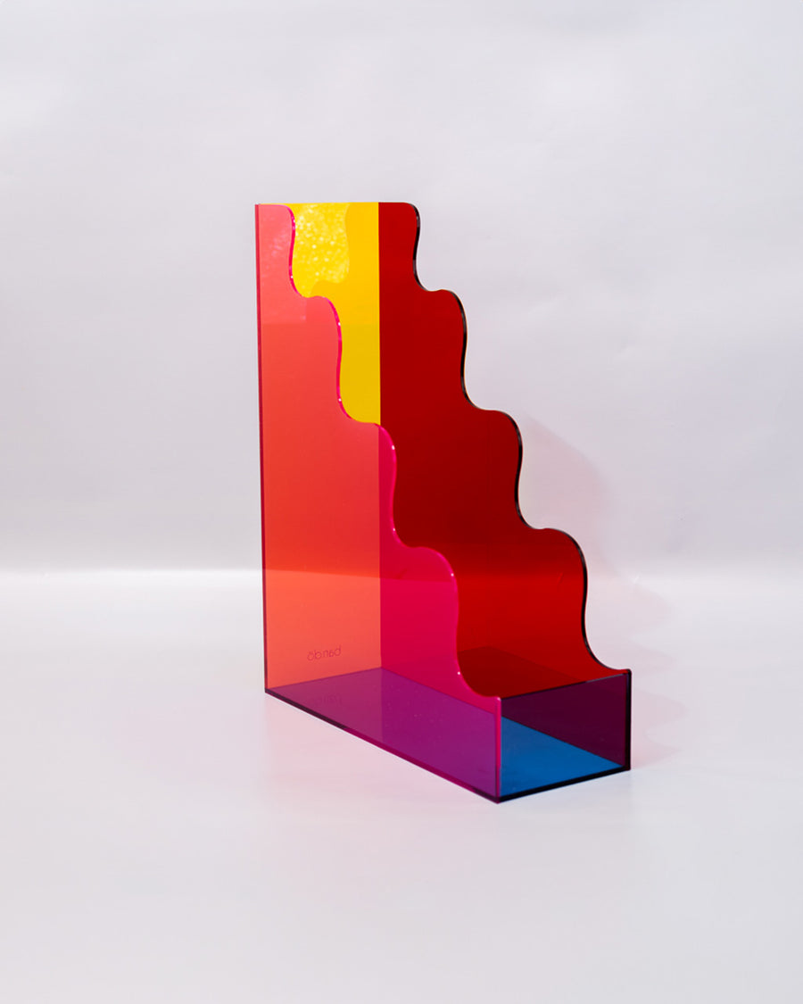 right side of red, pink, yellow and blue acrylic wavy file folder holder