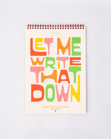 'let me write that down' 2025 wall calendar with colorful font and spiral top binding