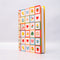 white mini notebook with colorful patchwork design (bows, heart, pretzel, strawberry etc)