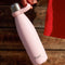 model holding light pink 17 oz stainless steel water bottle