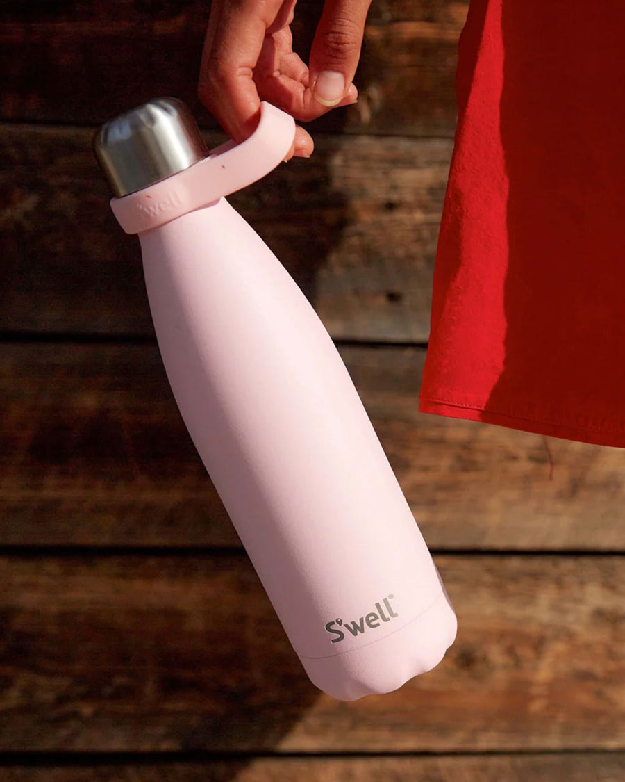 model holding light pink 17 oz stainless steel water bottle