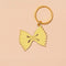 yellow enamel bowtie pasta keychain